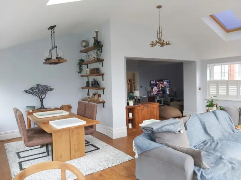 A modern living room in Newport with newly painted walls, showcasing Stone's Painting and Decorating's high-quality interior home painting services.